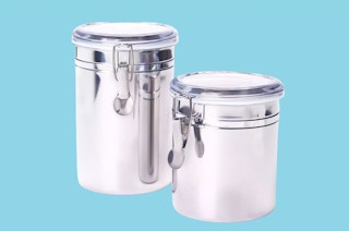 a set of two stainless steel canisters