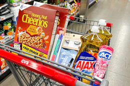 cheerios cereal, kiss nail files, ardell lashes, neutrogena wipes, ajax dish soap, and act toothpaste in a cart