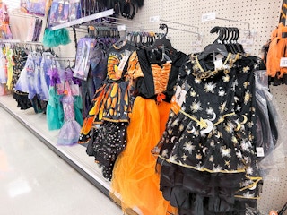 halloween costumes hanging in an aisle