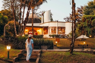 Woman walking to a Hilton Resort