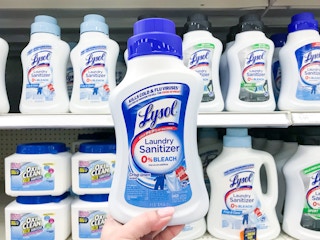 hand holding lysol laundry sanitizer at target