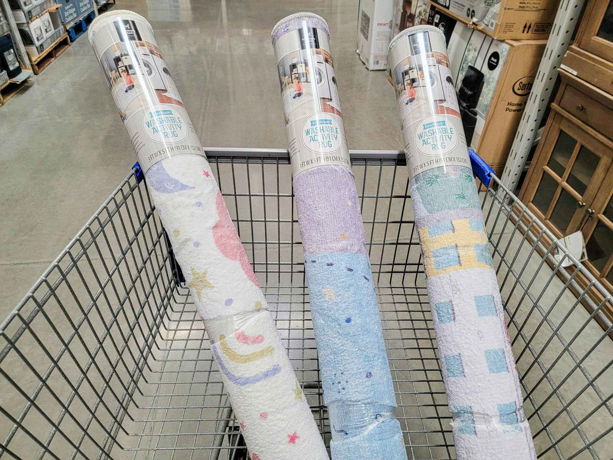washable activity rugs in a cart