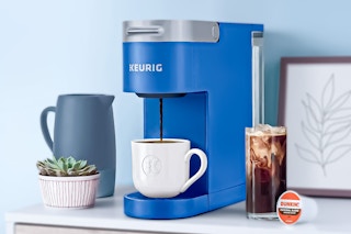 Blue eurig K-Slim Coffee Maker (lifestyle image of product brewing coffee)