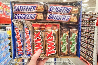 hand holding a box of candy bars