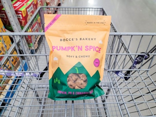 a bag of bocce's bakery pumpkin spice dog treats in a cart