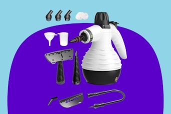 A white and black steam cleaner with a cone-shaped spout and several accessories for recharging and cleaning surfaces
