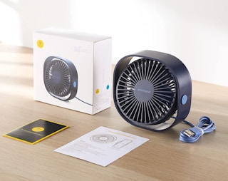 navy blue desk fan on a table