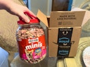 a jar of dog treats next to an Amazon box