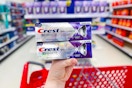 hand holding a crest 3d white premium toothpaste at target