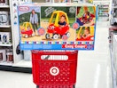 little tikes cozy coupe sitting on top a target cart