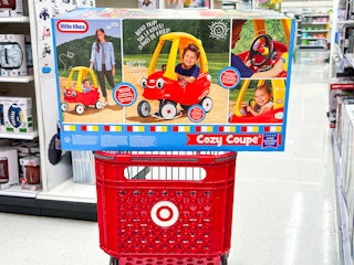 little tikes cozy coupe sitting on top a target cart