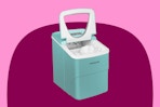light blue ice maker on a pink and maroon background