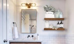 wooden shelves alongside a bathroom mirror and sink