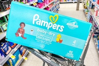 box of pampers diapers in shopping cart