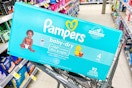 box of pampers diapers in shopping cart