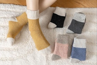 a woman sitting near wool socks