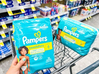 two pampers diapers in cart