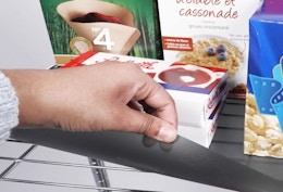 a wire shelf liner on a metal shelf with items on it 