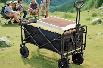 a wagon cart outside near a group of campers