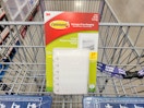 a pack of 3m command picture hanging strips in a cart