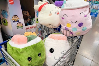 giant food plushes in a cart