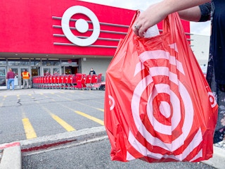 a target bag and receipt being held outside of target store
