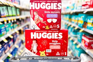 two large boxes of huggies diapers in a walgreens cart