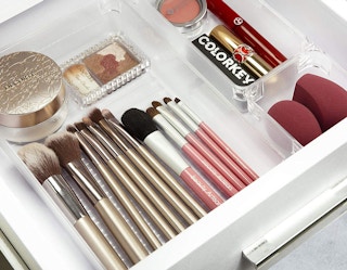 makeup organized in bins in a drawer