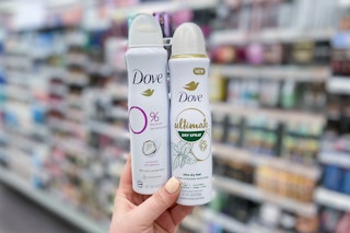 hand holding two dove dry sprays