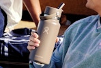 Guy holding the Hydro Flask Water Bottle.