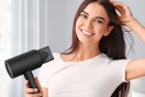 a woman using an ionic hair dryer