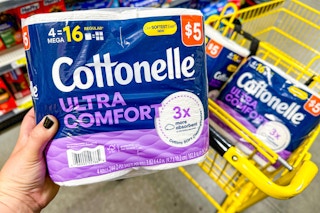 hand holding a pack of cottonelle toilet paper