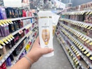 hand holding pantene hair products in walgreens aisle