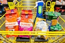 dunkin, knorr, dawn, and glade in a yellow shopping cart