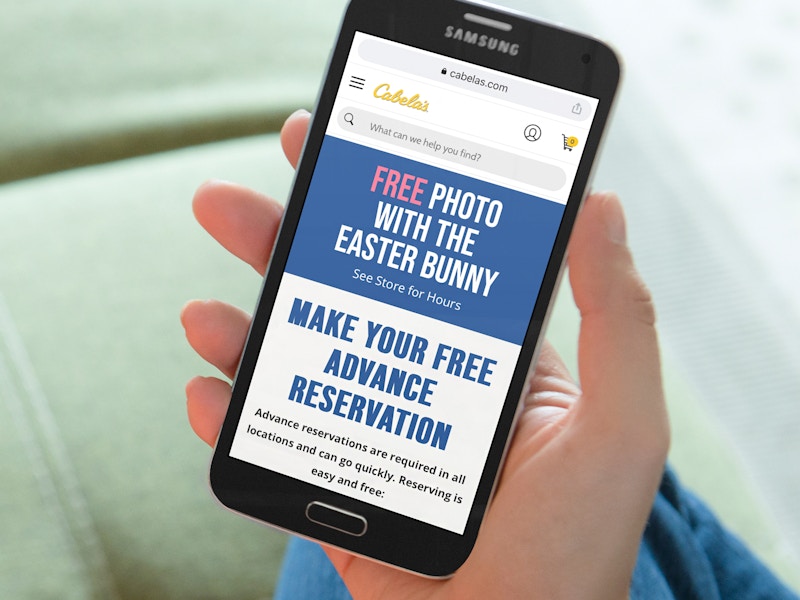 person on phone reserving easter bunny photos at cabelas