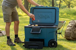 a man getting soda from a ninja cooler