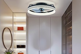 Lifestyle image of the FANNEHONNE led fan light in closet-like setting