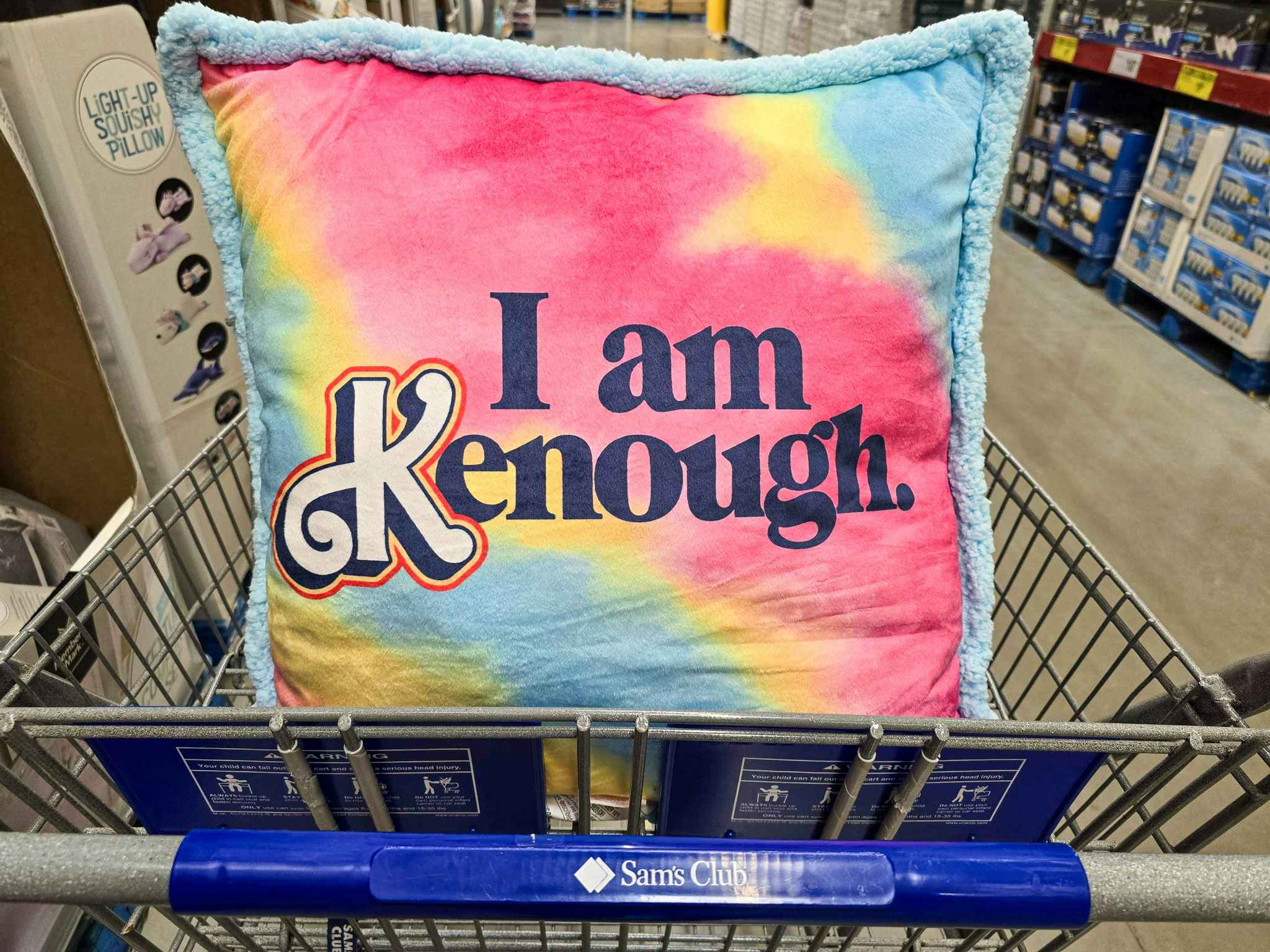 pillow that says "I am Kenough" in a shopping cart