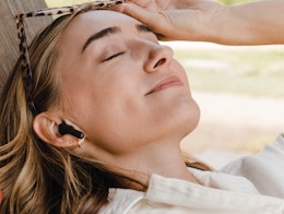 a woman wearing earbuds