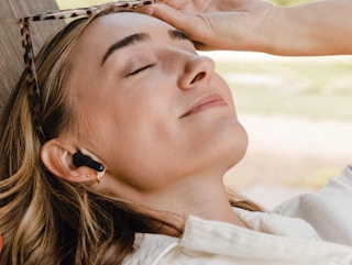 a woman wearing earbuds