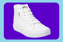 a pair of white kids vans high-top shoes