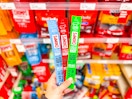 hand holding chomps beef sticks at target