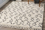 Lifestyle image (close up shot) of the Livabliss Berber Shag Area Rug (8 x 10 foot) in home setting