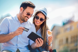 Couple shopping while travelling