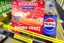 digiorno pizza and pepsi in dollar general shopping cart