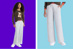 person wearing gray sweatpants on a blue background