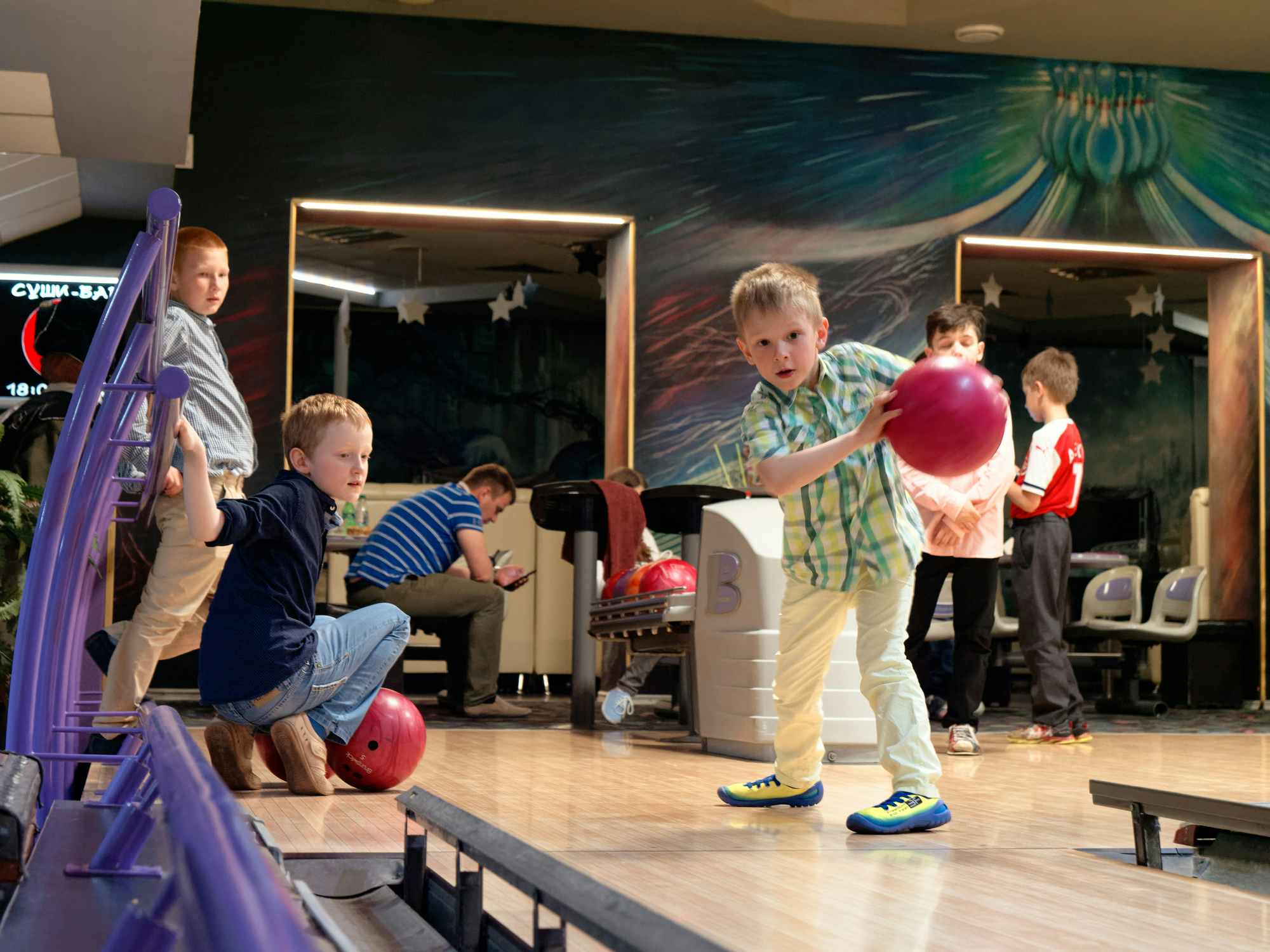 A group of children bowling together 2020
