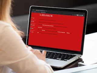 Someone looking at the Biblomania website on a laptop