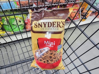 bag of snyders pretzels in a cart
