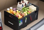 a trunk organizer with fruits and food in a trunk